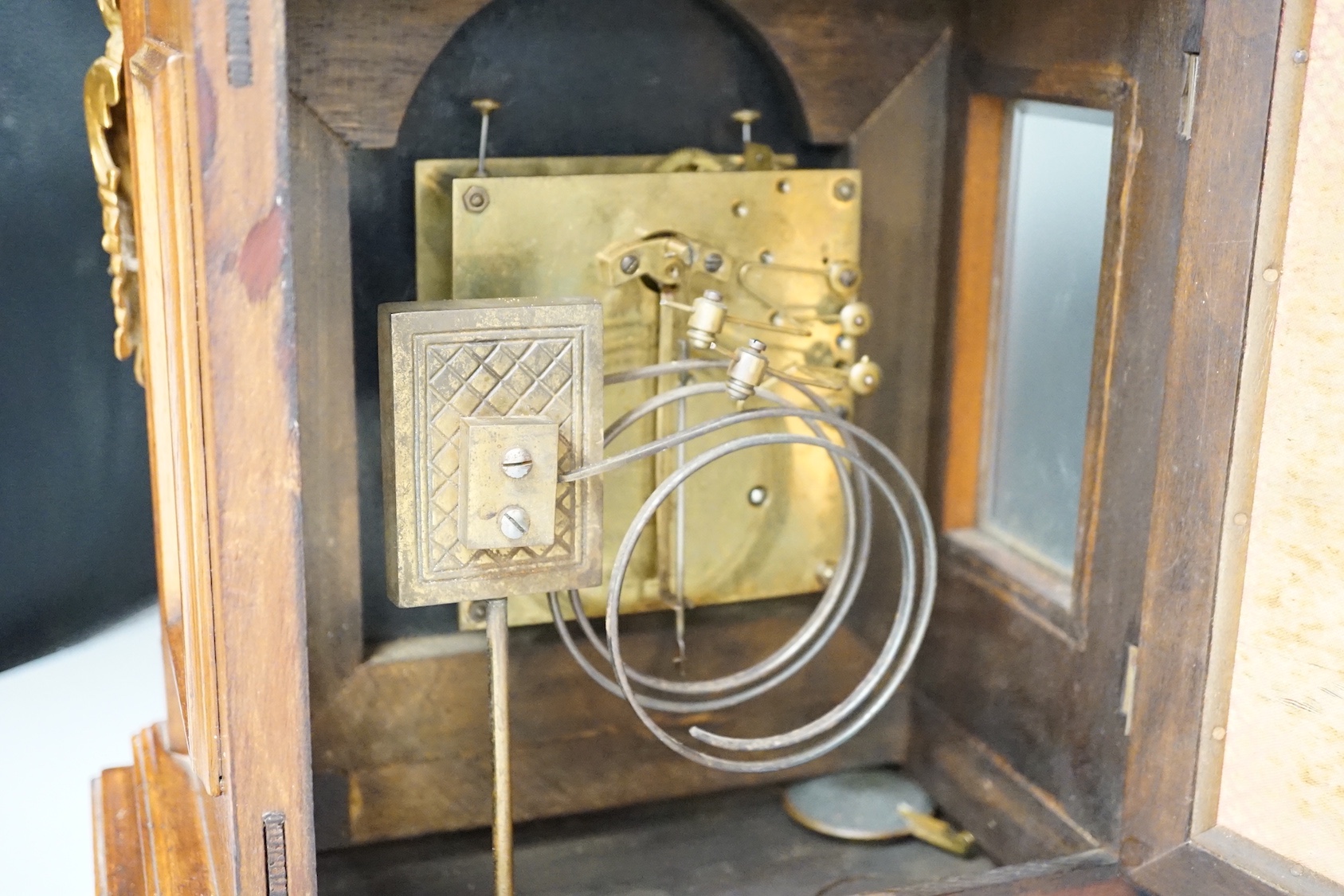 A reproduction gilt metal mounted bracket clock, 55cm